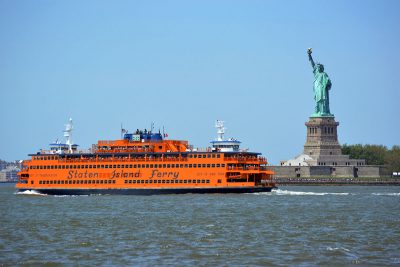 The Staten Island Ferry in front of the Statue of Liberty