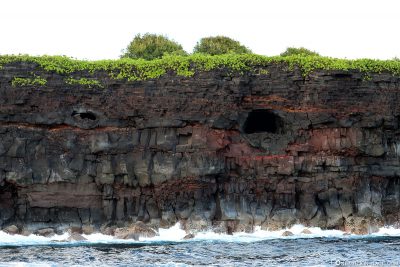 The old lava tubes in the cliffs
