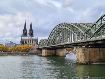 East view of Cologne Cathedral with Hohenzollern Bridge